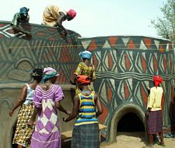 women painting house