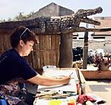 artist painting at aba house
